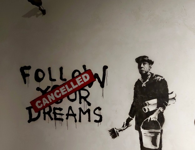 Foto van een werk van Banksy genomen in het Banksy museum in de Lakensestraat in Brussel